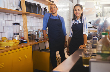 Image showing Small business owners or partners standing in a coffee shop together are happy to serve and provide good service. Portrait of entrepreneurs smiling and excited about the cafe startup