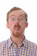 Image showing man showing his tongue