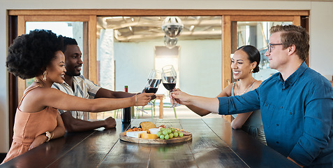 Image showing Double date of couples having dinner together and drinking wine at a restaurant celebrating and having fun. Romantic group of friends enjoying a lunch date in celebration of their love