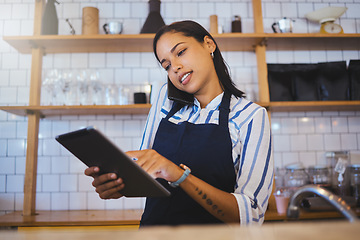 Image showing Cafe manager, planning online customer orders and working on digital tablet with internet, phone call and sales in restaurant startup. Small business owner, woman entrepreneur and hospitality worker