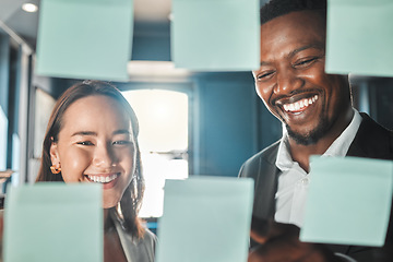 Image showing Business people planning ideas in meeting, thinking of marketing strategy and corporate collaboration in office at work. Employees, workers and team writing on sticky notes and paper storyboard