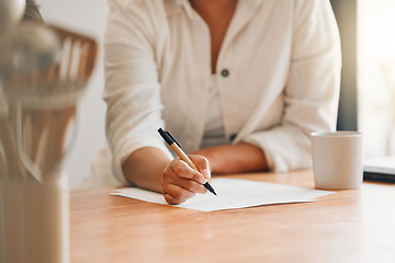 Image showing Writing, paperwork and contract with a woman holding a pen and filling out an application form in her kitchen at home. Insurance, tax and accounting while managing finance and the household budget