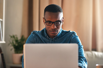 Image showing Freelance blogger typing on laptop, thinking of blog post or planning off story vision while working from home living room. Serious, ambitious or inspired writer or entrepreneur working on technology