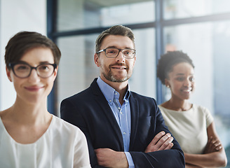 Image showing Proud and happy leadership of a business on a mission to achieve the company vision and growth. Portrait of a team of colleagues with a positive mindset smiling and standing in unity or support