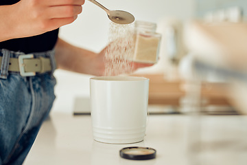 Image showing Diabetes, overuse of sugar and unhealthy sweets for mug of tea, coffee or hot drink at home. Closeup of woman making, drinking and preparing beverage with teaspoon of substitute, glucose or stevia