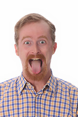 Image showing man showing his tongue