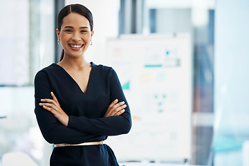 Image showing Confident, happy and smiling business woman standing with her arms crossed while in an office with a positive mindset and good leadership. Portrait of an entrepreneur feeling motivated and proud