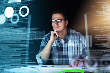 Image showing Male IT computer engineer working on a futuristic hologram or cgi screen at his office desk. Tech designer working on technology to test new and innovative data. Web developer work on a digital code