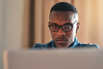 Image showing Freelance web designer with laptop thinking of website ideas, planning webpage and coding on technology while working from home. Serious, ambitious or inspired entrepreneur designing vision into code
