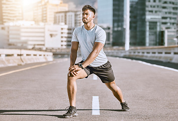 Image showing Runner stretching legs for exercise, workout and fitness training for sport performance in the urban city. Motivation, active and running wellness athlete ready for sports run, marathon or health jog