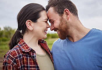 Image showing Happy mature couple bonding, laughing and having a romantic, intimate moment outdoors together. Smiling husband and wife showing affection, embracing. Soulmate feeling free, loving their relationship