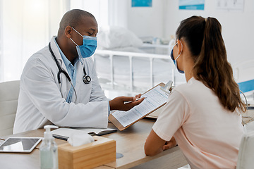 Image showing Health insurance, compliance and medical admin in covid pandemic, doctor consulting with patient in office. Healthcare professional helping a woman, discussing plan while signing permission form