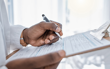 Image showing Doctor writing survey, insurance and claim form for medical paperwork, document and script for patient records, test result and research in a hospital. Physician hands signing and planning healthcare