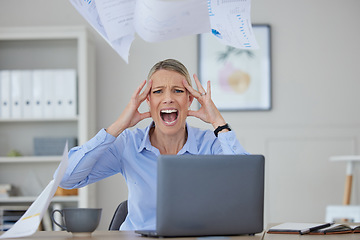 Image showing Angry, stress and woman screaming at her office desk in frustration and fear at work issues. Serious panic, rage or headache from news about audit, tax or bankruptcy while at corporate job.