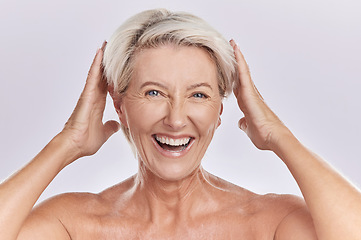 Image showing Mature, portrait and woman touching hair against studio background with happy face copy space. Wellness woman for skincare, beauty cosmetics or healthy body supplements for anti ageing.