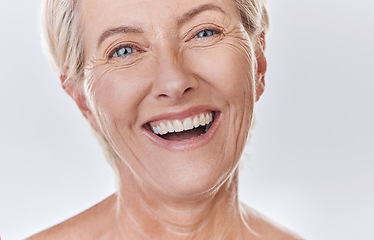 Image showing Dentist, veneers or dentures in senior woman mouth or teeth looking happy with her oral hygiene or dental cleaning cosmetic service. Mature model with smile on face for dentistry, health and wellness