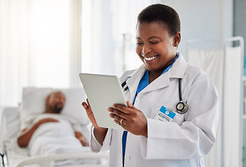 Image showing Happy news with doctor reading exciting email or test results on digital tablet, feeling positive at hospital. Young health care worker getting good news of cure or treatment for her sick patient