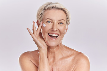 Image showing Skin, skincare or collagen lotion with old woman posing with a smile with her cosmetics and product. Senior female, facial cream and sunscreen for a healthy face and beauty model wellness portrait.