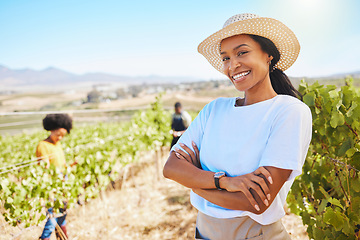 Image showing Confident or proud farmer with arms crossed and smile vineyard agriculture field. Young woman on sustainable wine or green fruit farm in summer. Worker happy with growth sustainability on countryside