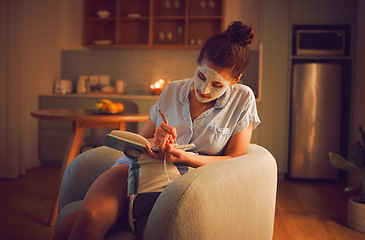 Image showing Selfcare, grooming and creative writing by a woman making notes in diary while giving herself a facial. Relaxed female planning ideas for a novel in a journal, enjoying free time and a calming hobby