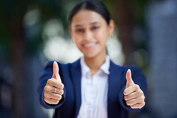 Image showing Thumbs up, blurred and working woman does agree by doing hand gesture to express she is happy. Employee likes and smiles about good news about reaching best professional career goal at work.