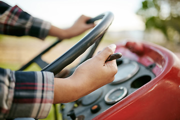 Image showing Farm, tractor and agriculture with hands of a farmer driving a vehicle on a farm for sustainability, growth and development in a sustainable and green environment. Farming crops in the harvest season