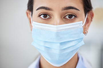 Image showing Covid doctor with face mask for safety, medicine and hygiene while working in a medical hospital or clinic. Portrait of woman nurse, healthcare expert and professional worker in corona virus pandemic