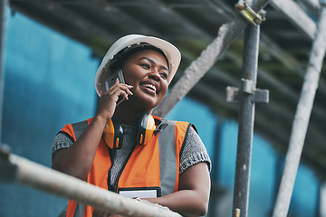 Image showing Construction manager, contractor and engineer talking on a phone while planning logistics at a building site in town. Happy, smiling and cheerful young female architect, supervisor and city planner