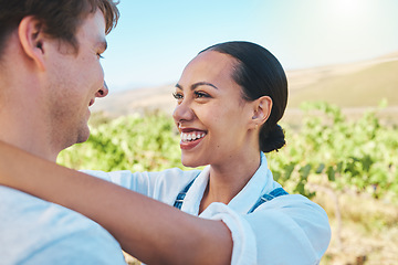 Image showing Love, countryside and couple smile, loving and bond together on a sunny wine farm field and nature agriculture. Interracial, green and happy man and woman travel to a holiday vacation trip in summer