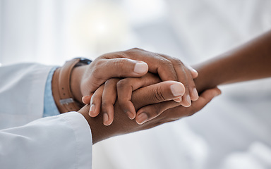 Image showing Support, trust and hospital care with a doctor and patient holding hands, sharing bad news of a cancer diagnosis. Kind doctor offering a loving gesture to a sick person during a health crisis