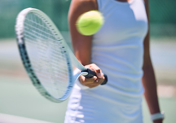Image showing Closeup tennis ball, racket and sport for fit, active and healthy player hitting, training and exercising for practice. Porfessional player warming up for routine workout and exercise match on court