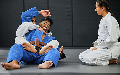 Image showing Karate, fitness and martial arts students learning sport, training and discipline from their coach at workout, exercise or gym club. Sports, healthy and team in fighting practice from an instructor