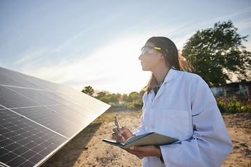 Image showing Woman working in solar energy, writing research on solar panels and studying sustainability of clean energy in summer. Scientist expert doing analysis on future innovation and green electricity