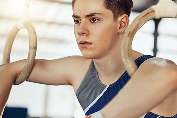 Image showing Sport, exercise and training rings for a gymnastics athlete or gymnast in a gym. Fit and active sportsman doing fitness, wellness and sports workout to train his strength and flexibility