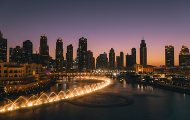 Image showing Unique view of Dubai Dancing Fountain show at night.