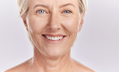 Image showing Portrait of a happy senior womans face against studio mockup background. Healthy and natural mature model with smooth skin. Feeling radiant and fresh with her healthcare or skincare cosmetic routine