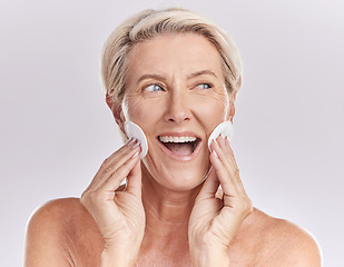 Image showing Senior woman skincare and face with product remover and makeup cleaning or beauty model with cosmetic cotton pads on studio mockup background. Happy woman face, headshot and wrinkles or skin care