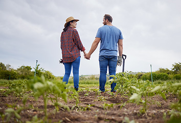 Image showing Farmer couple happy about agriculture growth with vegetable crops or plants in aorganic or sustainability farm or garden. Man and woman in nature love and enjoying outdoor and having fun together