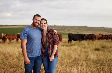 Image showing Farmer couple working on cow farm in the countryside for meat, beef and cattle food industry on sustainability field, agriculture environment and nature land. Portrait of happy people farming animals