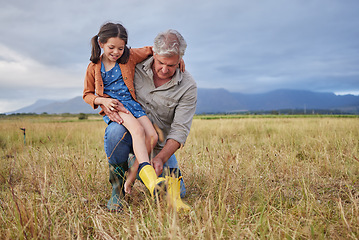 Image showing Happy family bonding on farm grandparent and girl having fun in nature, prepare for walk together. Smiling child and caring grandfather exploring outdoors, enjoying a walk in the countryside or field