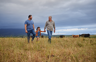 Image showing Farmer family walking on a cattle or livestock farm teaching and learning together. Generations of a happy father, grandfather and grandchild bonding on sustainability agriculture land