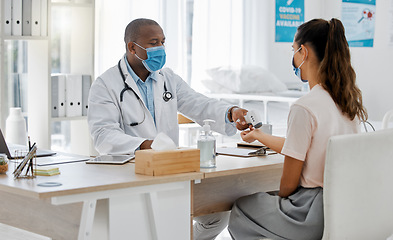 Image showing Doctor check fever of sick covid patient to test risk of cold, flu or corona in surgery. Healthcare worker consulting with laser thermometer for virus safety and wellness service in medical hospital