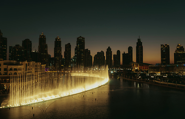 Image showing Unique view of Dubai Dancing Fountain show at night.