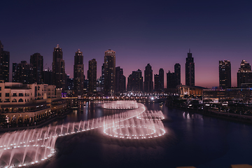 Image showing Unique view of Dubai Dancing Fountain show at night.