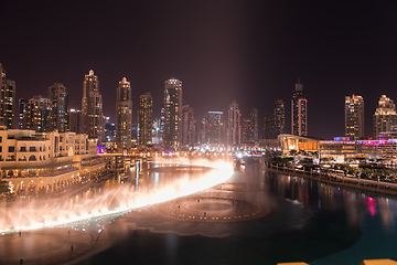 Image showing Unique view of Dubai Dancing Fountain show at night.