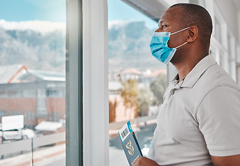 Image showing Man at airport with covid passport, travel visa and mask for plane flight of international immigration. Tourist, traveller and passenger waiting at window for airplane departure in corona pandemic