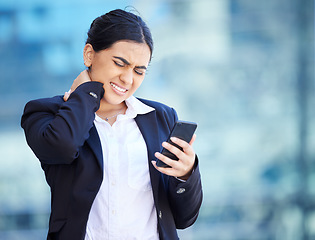 Image showing Headache, injury and neck pain while texting, business woman suffering from hurt spine and poor posture. Female entrepreneur holding head while reading a text, upset by bad news or negative feedback