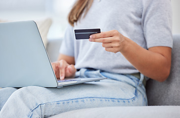 Image showing Banking, paying and online shopping with laptop and credit card by a woman at home. Casual female purchasing, buying and ordering products on the web or internet or a website with a app on ecommerce