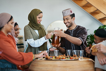 Image showing Ramadan, Eid and iftar with a muslim family celebrating breaking of the fast with food and drink at home. Bonding, feeling together and enjoying a traditional islamic feast and holy celebration