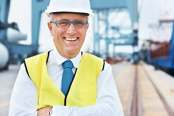 Image showing Happy cargo, logistics and shipping manager smile on a port with a factory, warehouse or plant in the background. Manufacturing, supply chain and freight leader in the industrial delivery business